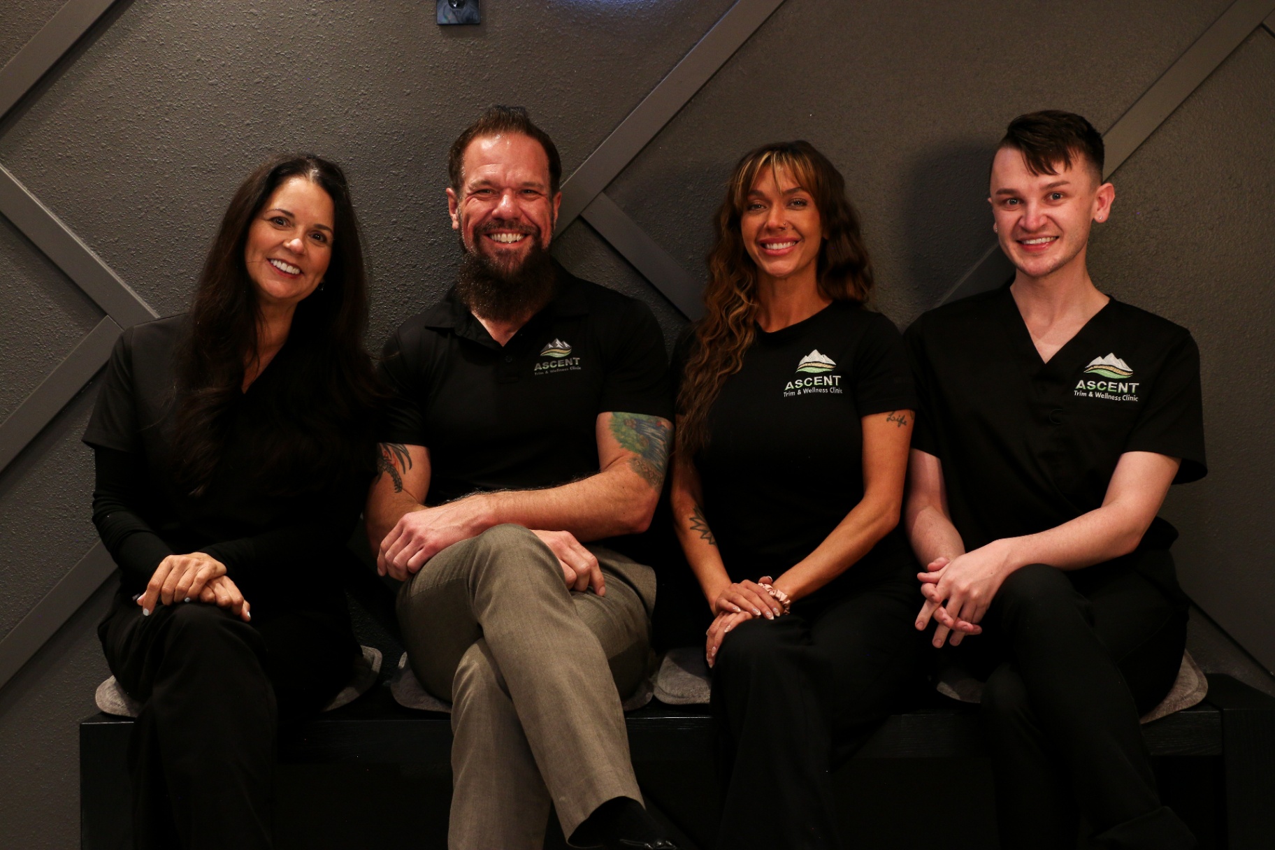 The Ascent Trim & Wellness team seated together in the Colorado Springs clinic
